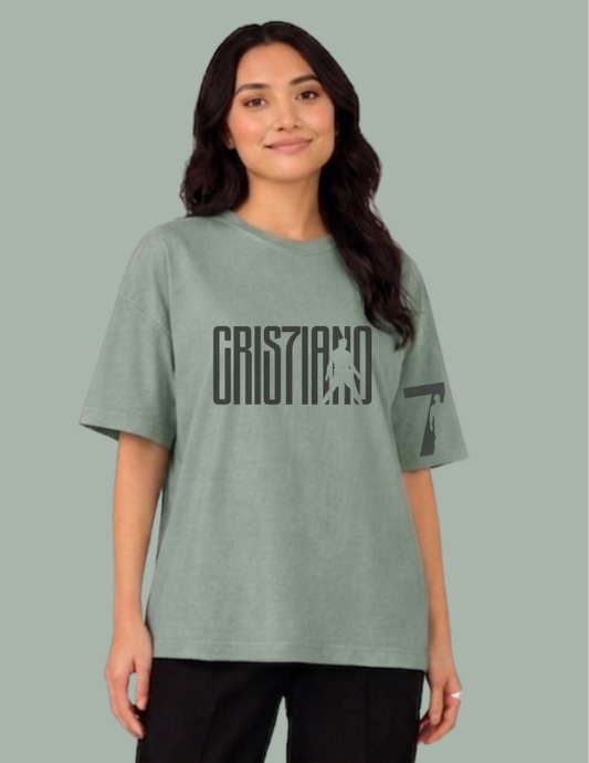 Person wearing a green t-shirt with text on a gray background