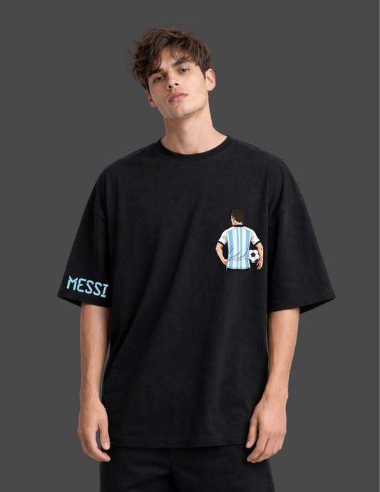 Person wearing a black t-shirt with a graphic design and 'MESSI' text on a dark background