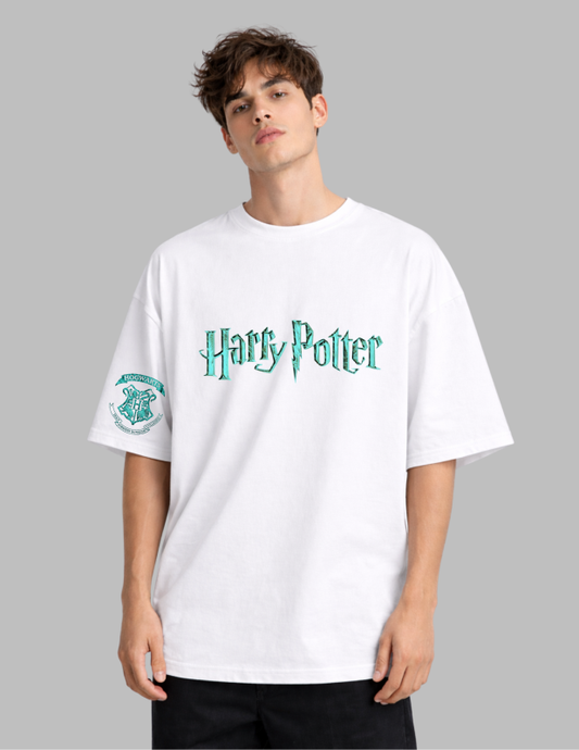 Person wearing a white 'Harry Potter' t-shirt with green text on a gray background