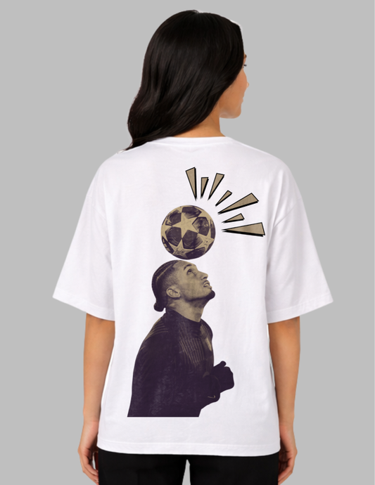 Person wearing a white t-shirt with a graphic design on the back, featuring a soccer ball and a person's head.
