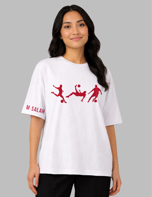 Woman wearing a white t-shirt with red graphics and text on a gray background