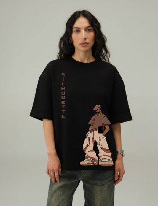 Person wearing a black t-shirt with a graphic design on a plain background