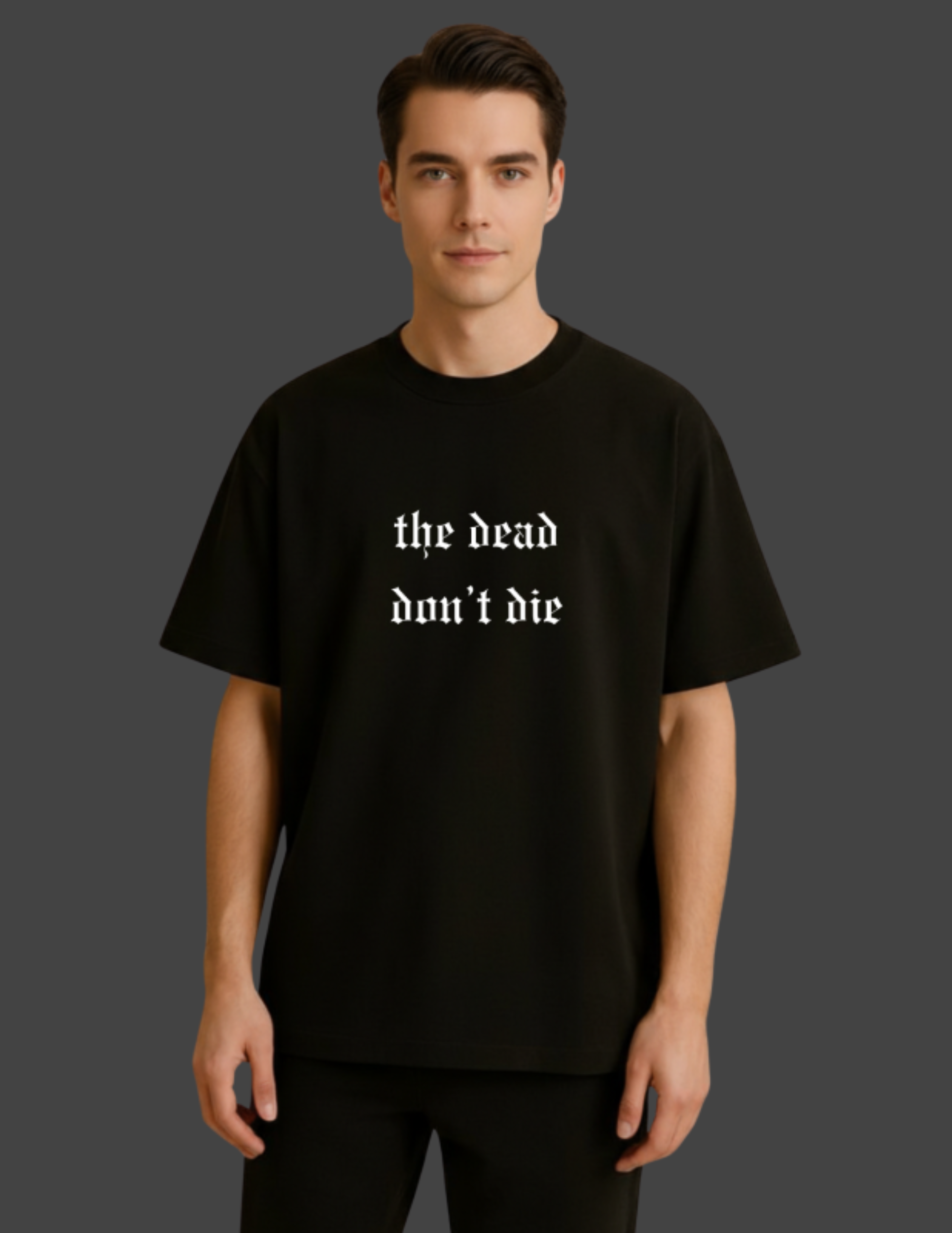 Person wearing a black t-shirt with 'the dead don't die' text on a dark background