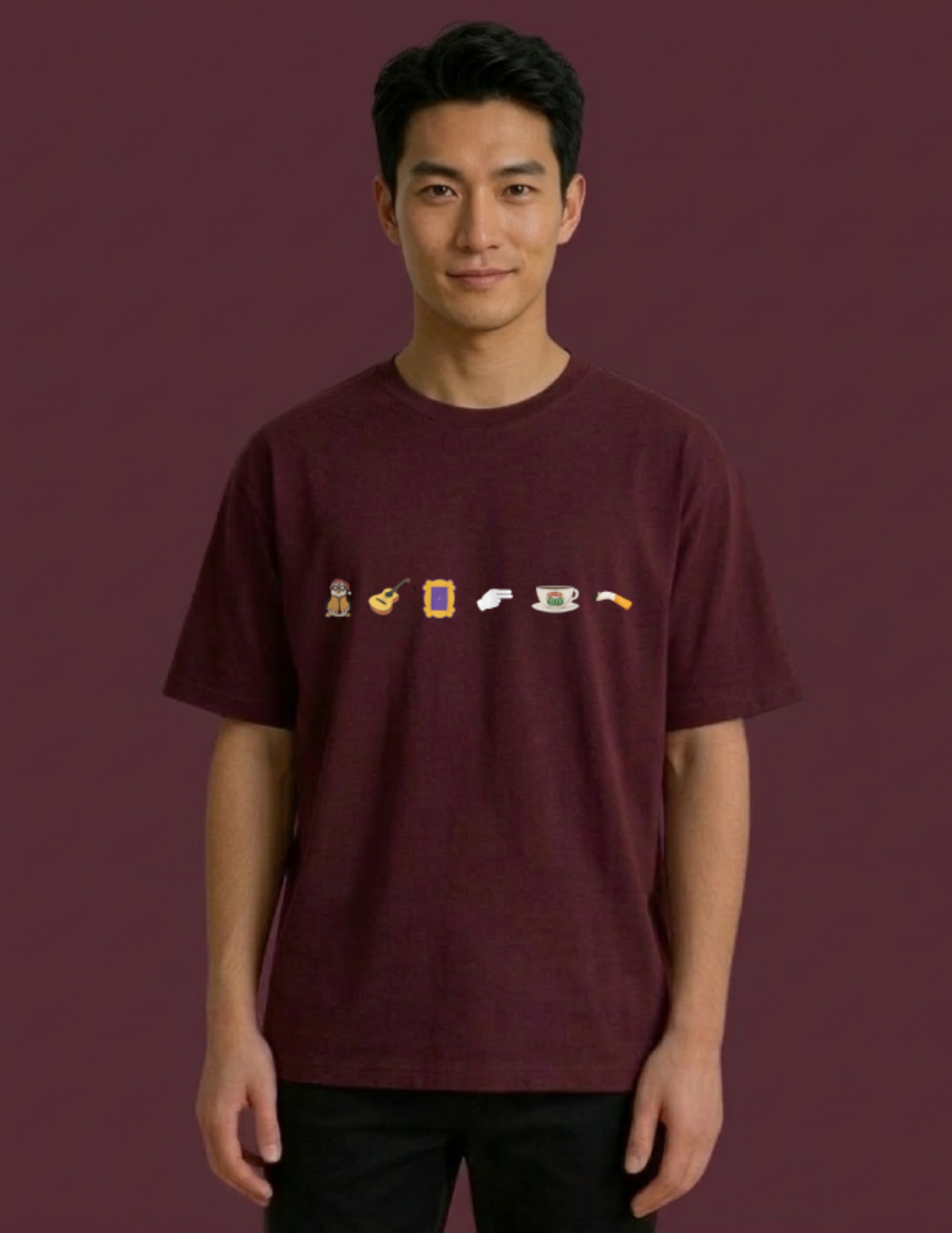 Person wearing a maroon t-shirt with small graphic designs on a dark red background