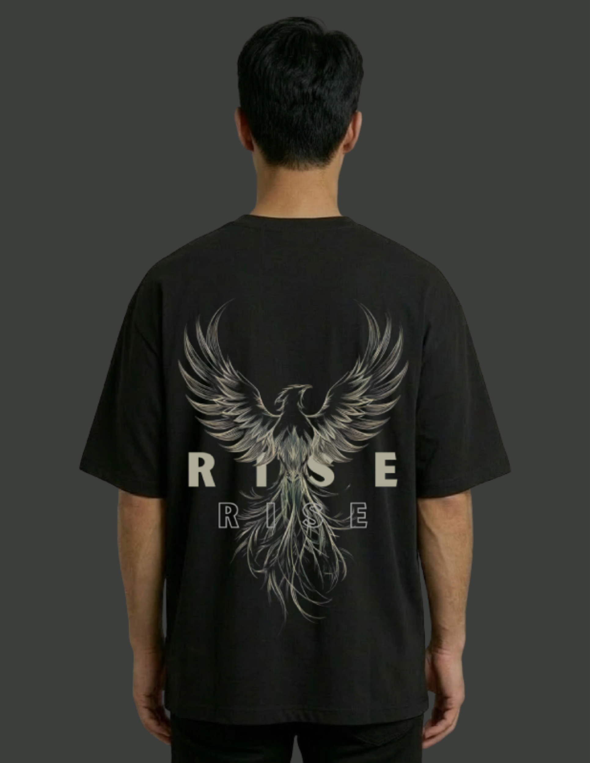 Person wearing a black t-shirt with a phoenix design and 'RISE' text on the back.