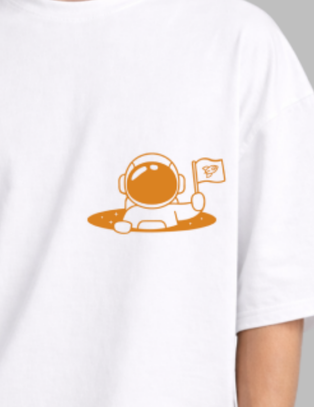 White t-shirt with an orange astronaut graphic on a plain background