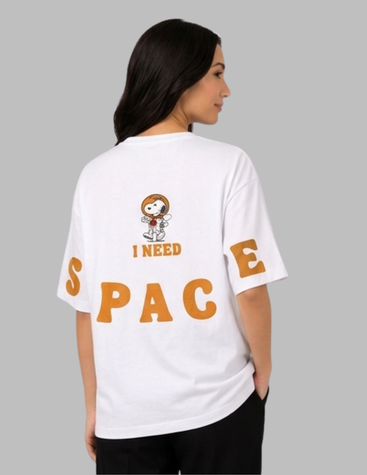 Person wearing a white t-shirt with 'I Need Space' text and cartoon character on a gray background