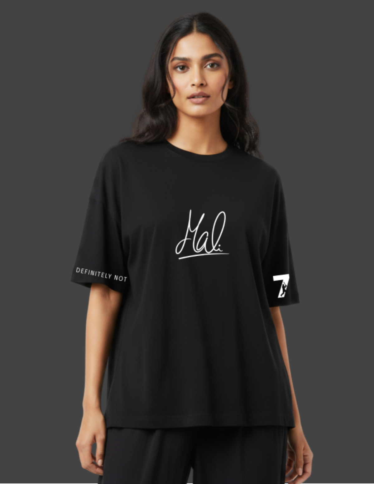 Person wearing a black t-shirt with white text on a dark background