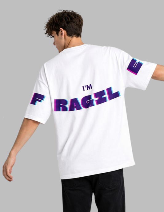 Person wearing a white t-shirt with colorful text on a gray background