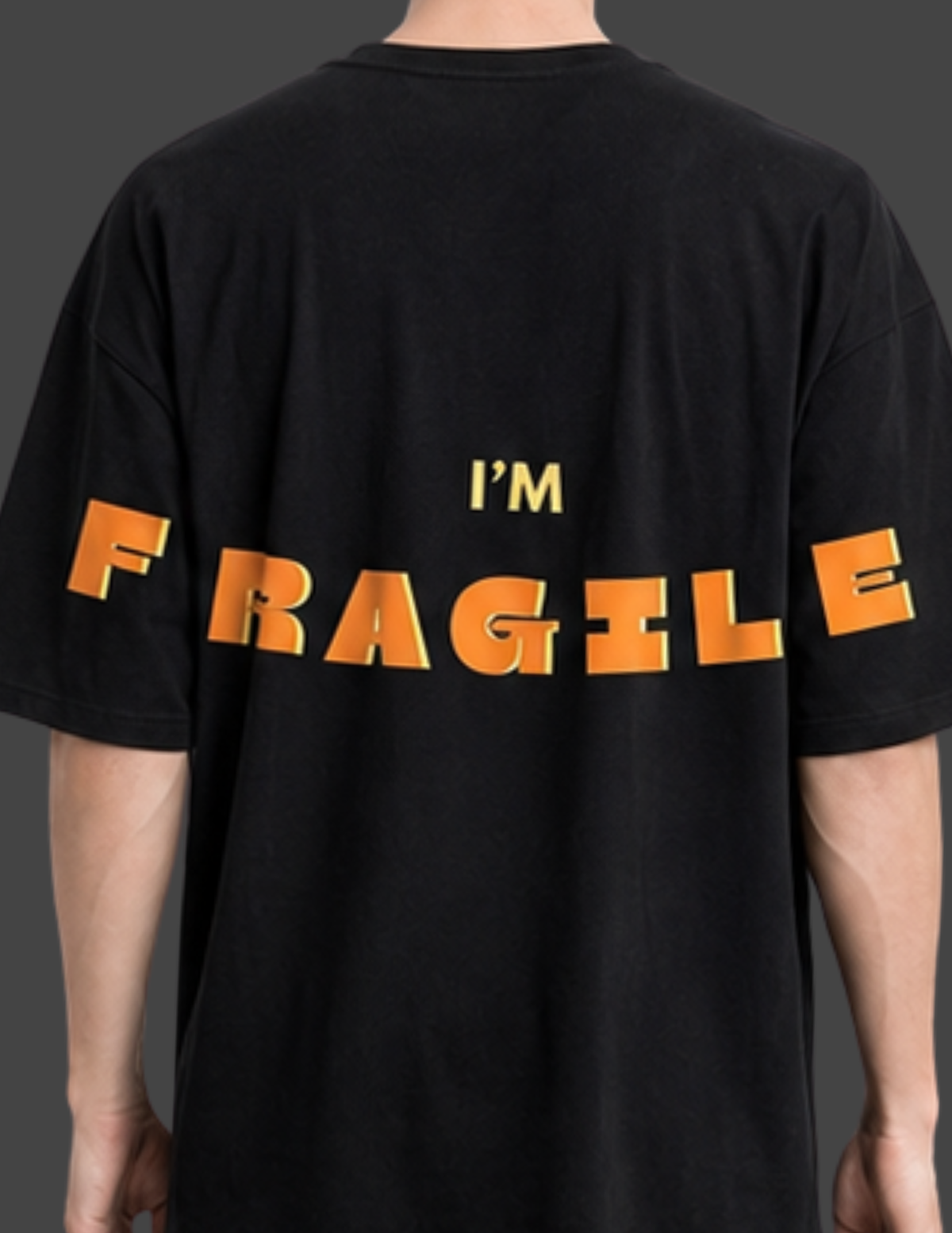 Black t-shirt with 'I'm Fragile' text in orange on a plain background