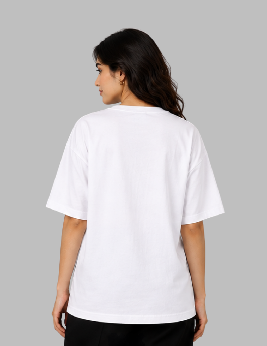 A woman shown from the back wearing a plain white short-sleeve T-shirt against a solid gray studio background.