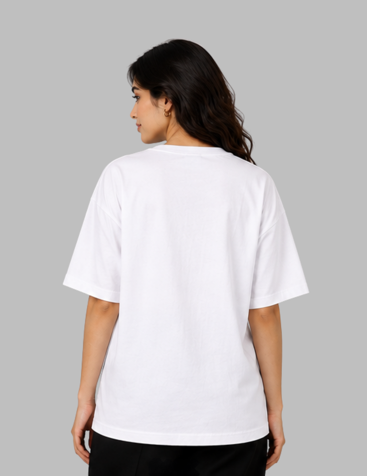 A woman shown from the back wearing a plain white short-sleeve T-shirt against a solid gray studio background.