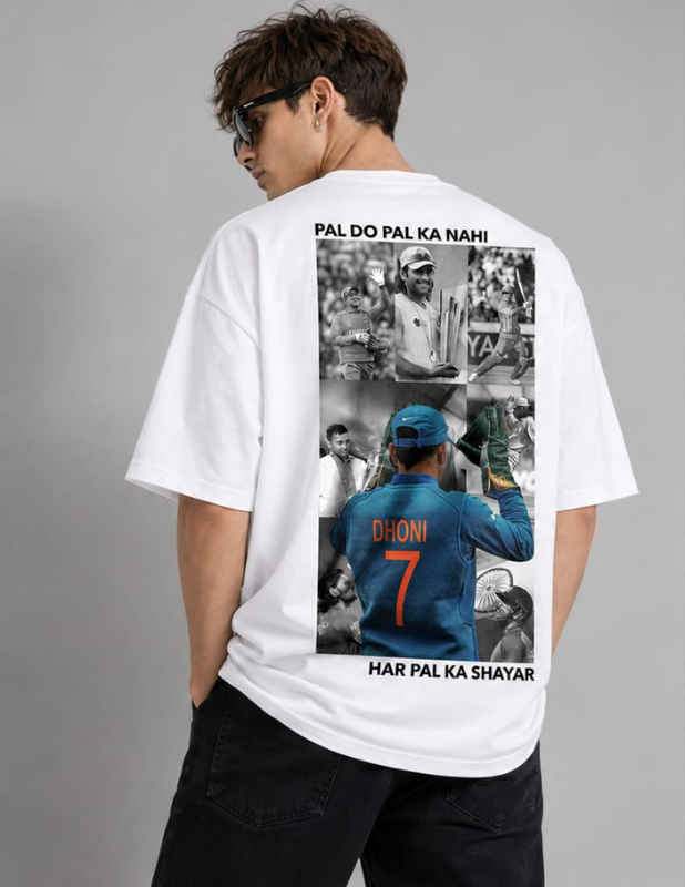 A man wearing a white oversized T-shirt from the back, featuring a large graphic print of cricket player Harpal Dhoni with the text 'PAL DO PAL KA NAHI' and 'HAR PAL KA SHAYAR'.