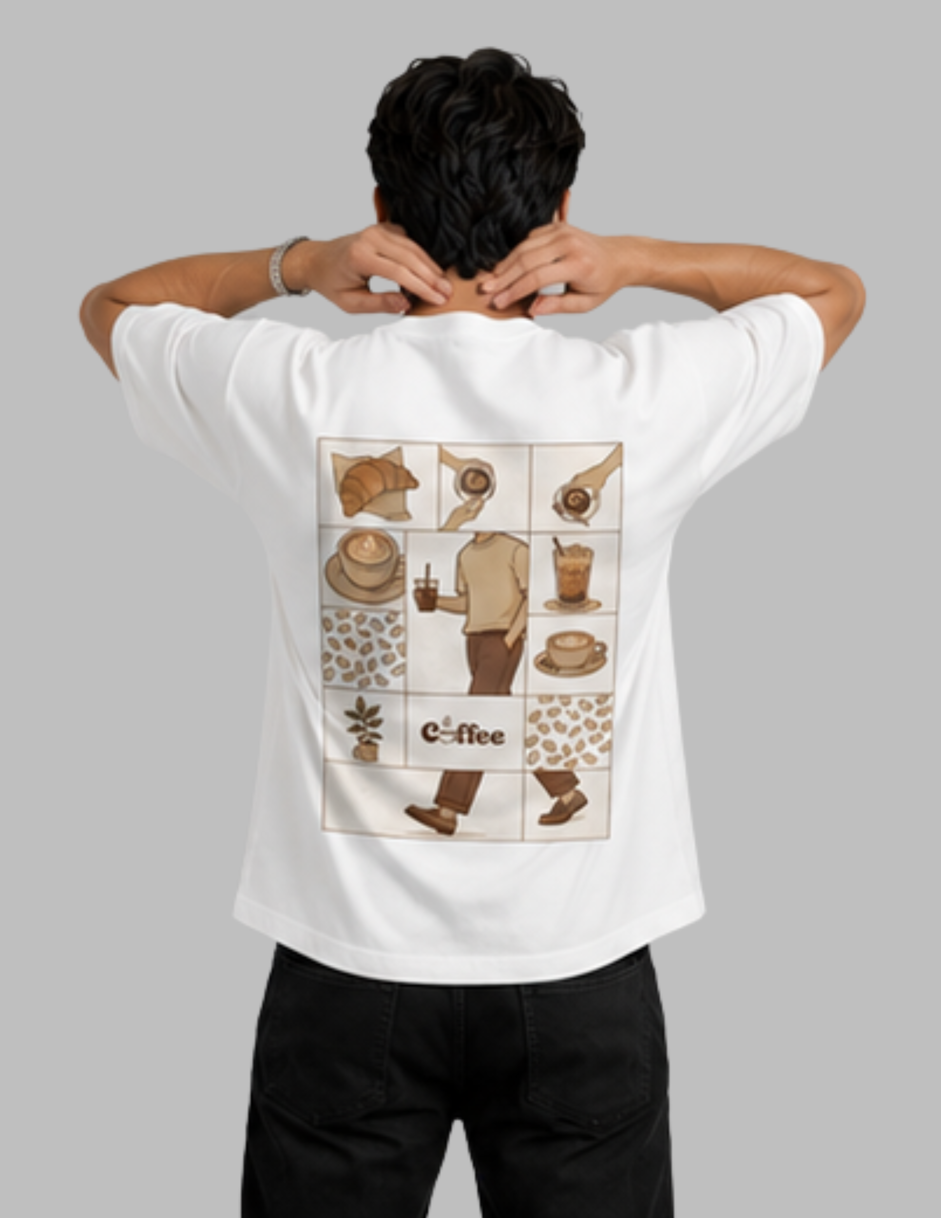 A man viewed from behind wearing a white t-shirt with a large brown coffee-themed graphic print on the back, paired with black pants, against a solid gray background.