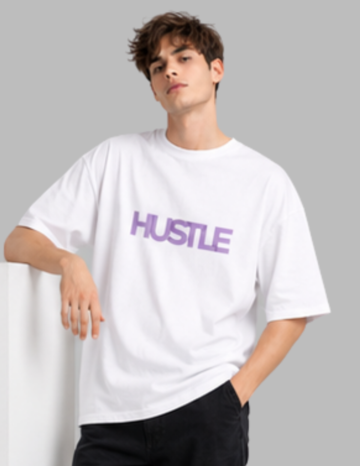 Person wearing a white t-shirt with 'HUSTLE' in purple text on a gray background