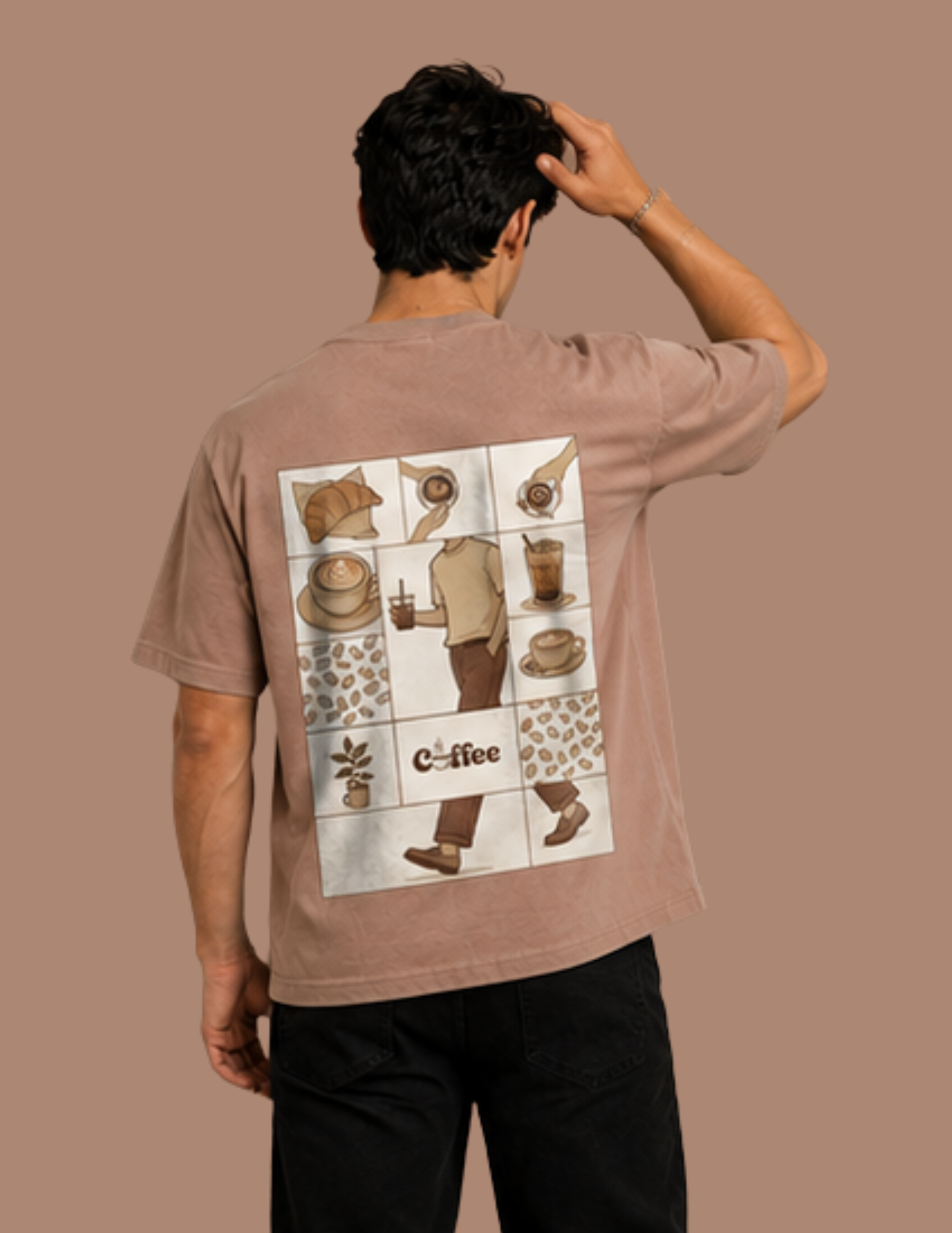 A man shown from behind wearing a light brown t-shirt with a large white graphic print on the back featuring coffee-themed illustrations and the word 'coffee'.
