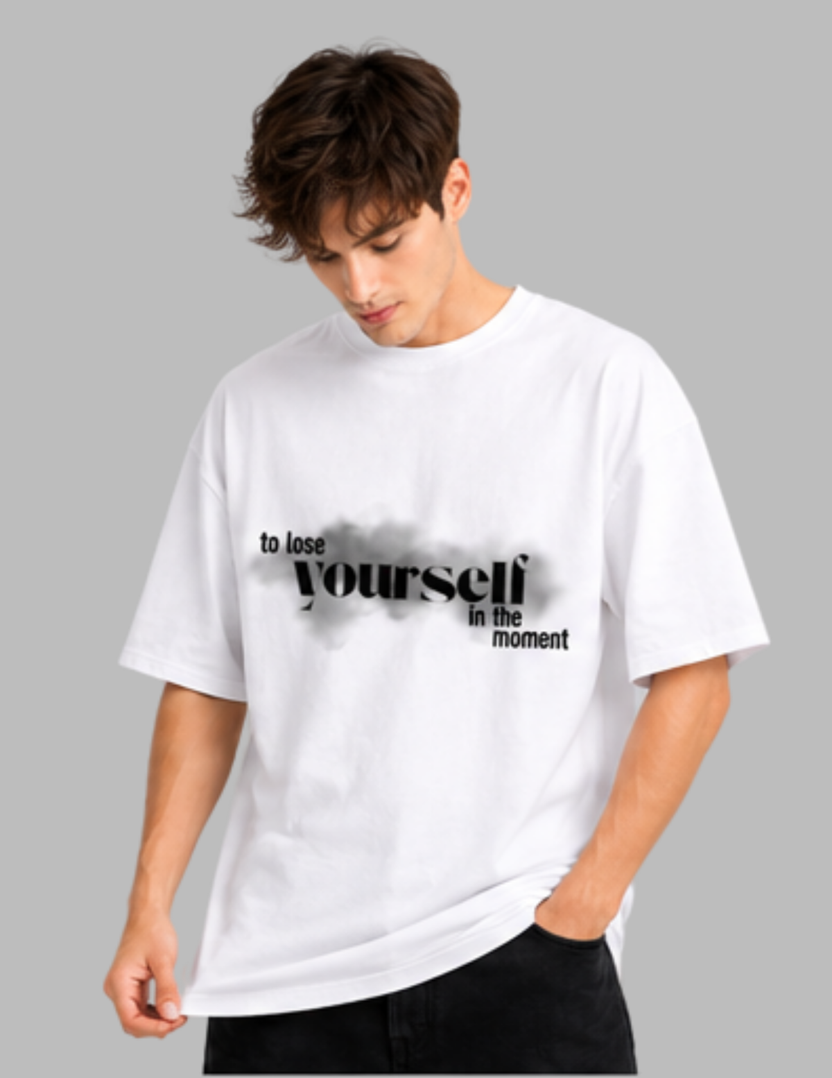 Person wearing a white t-shirt with a motivational quote on a gray background