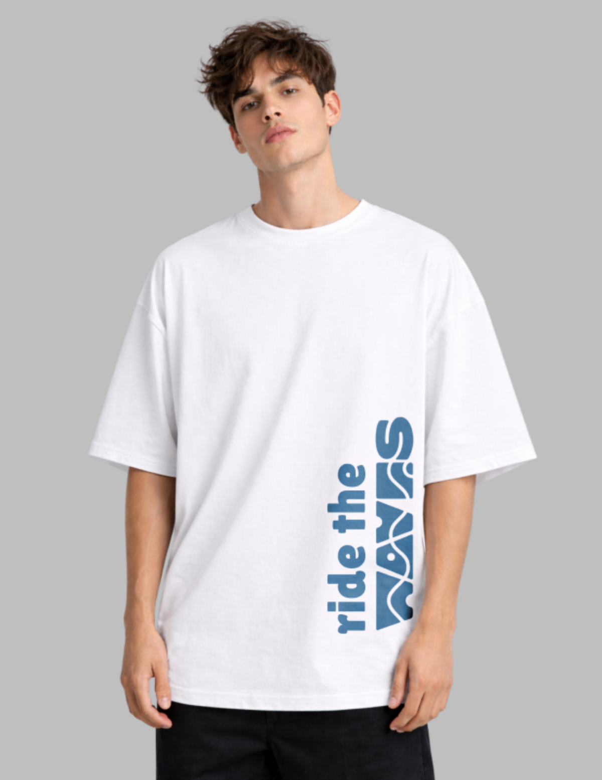 Person wearing a white t-shirt with blue text on a gray background