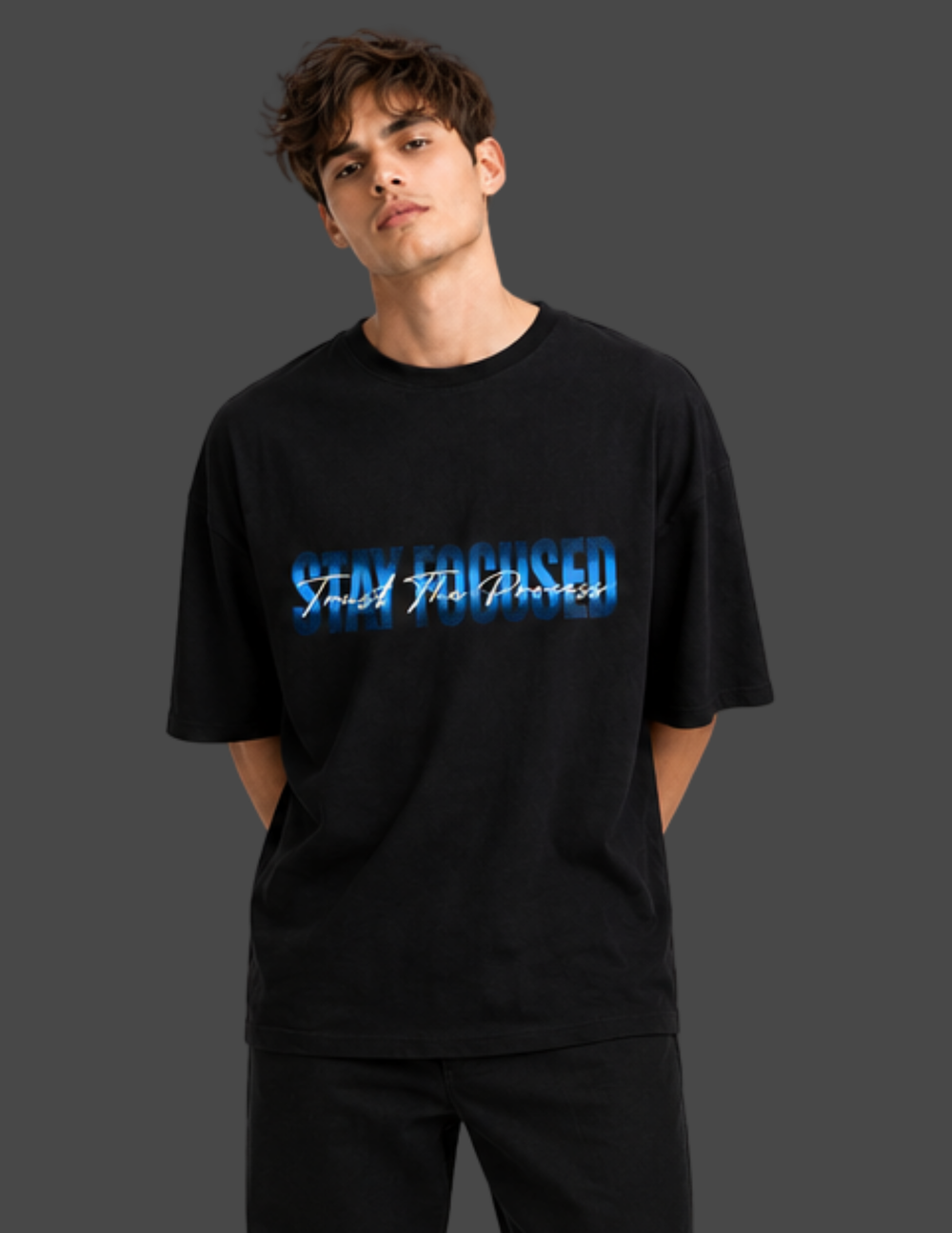 Person wearing a black t-shirt with blue text on a dark background