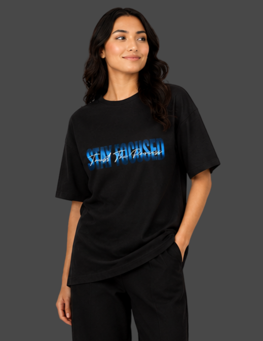 Person wearing a black t-shirt with blue text on a dark background