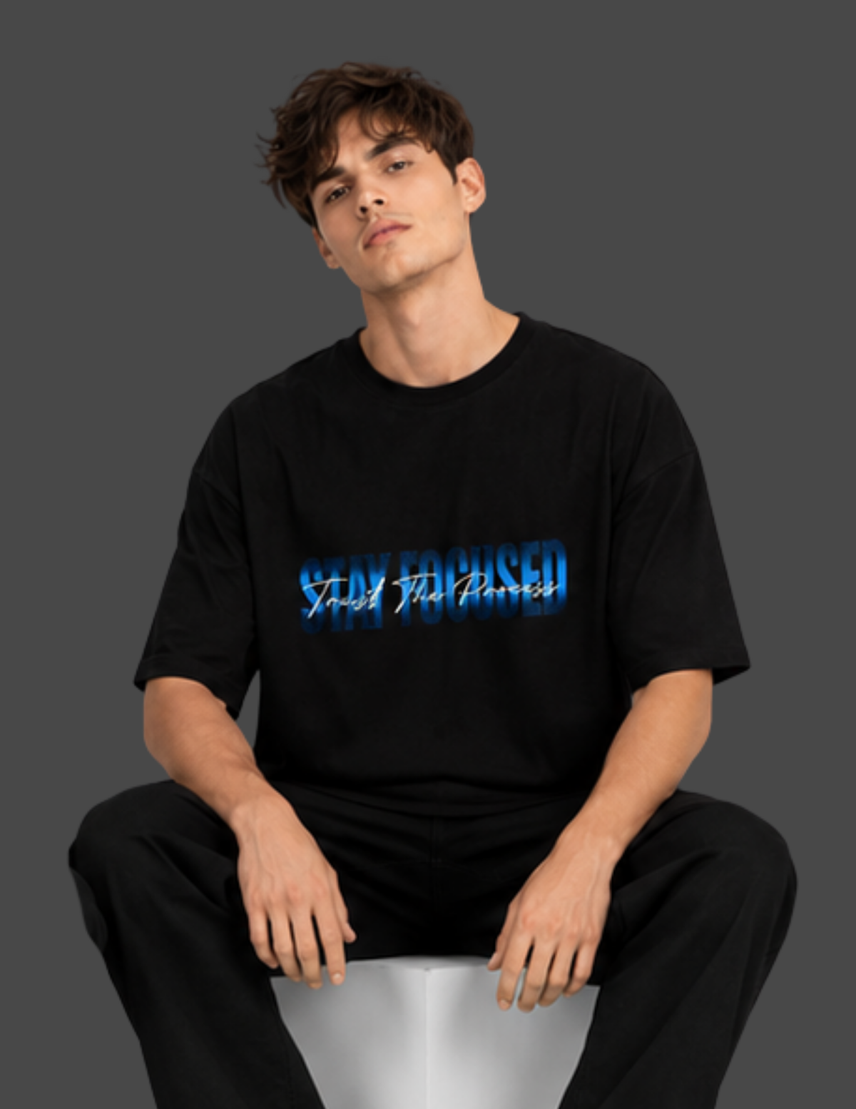 Person wearing a black t-shirt with blue and white text on a dark background