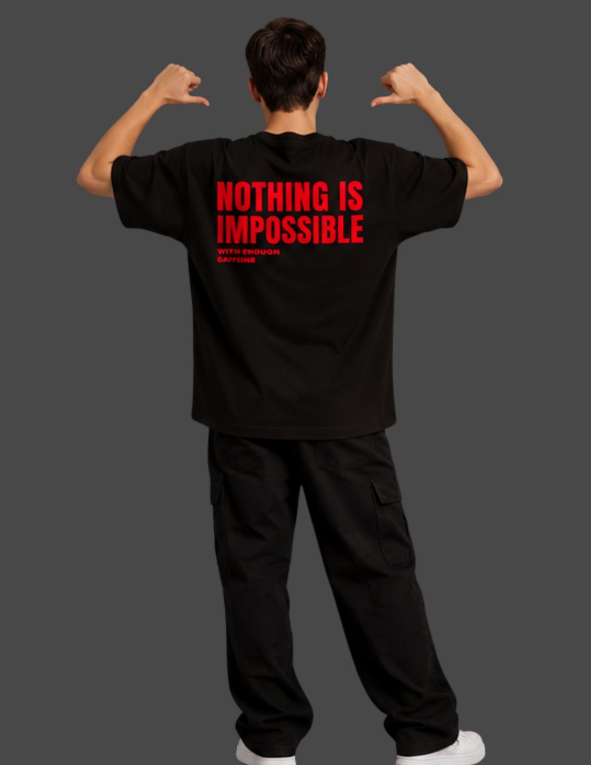 A man shown from behind wearing a black t-shirt with bold red text that reads 'NOTHING IS IMPOSSIBLE' and smaller text 'WITH STRENGTH - SHOTGUN'. He is posing with his hands near his shoulders against a solid dark gray background.