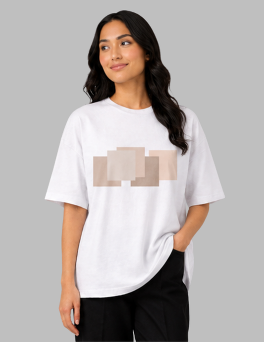 Woman wearing a white t-shirt with a graphic design on a gray background