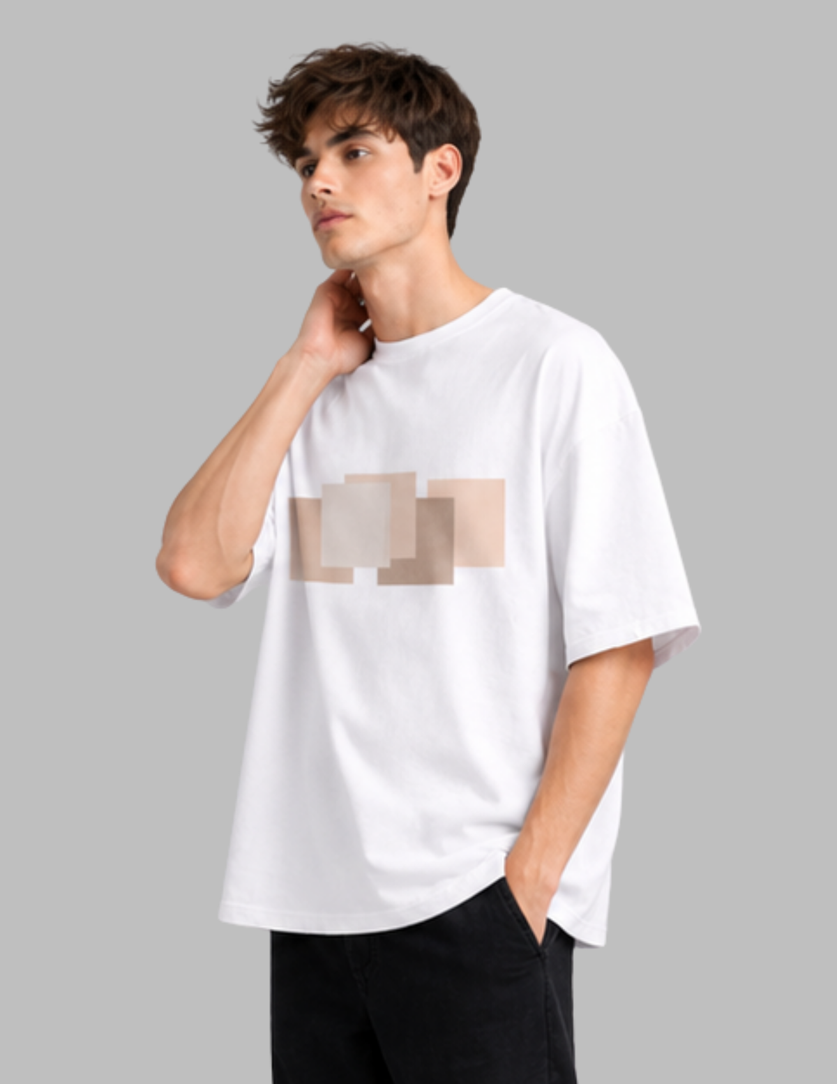 Person wearing a white t-shirt with a graphic design on a gray background