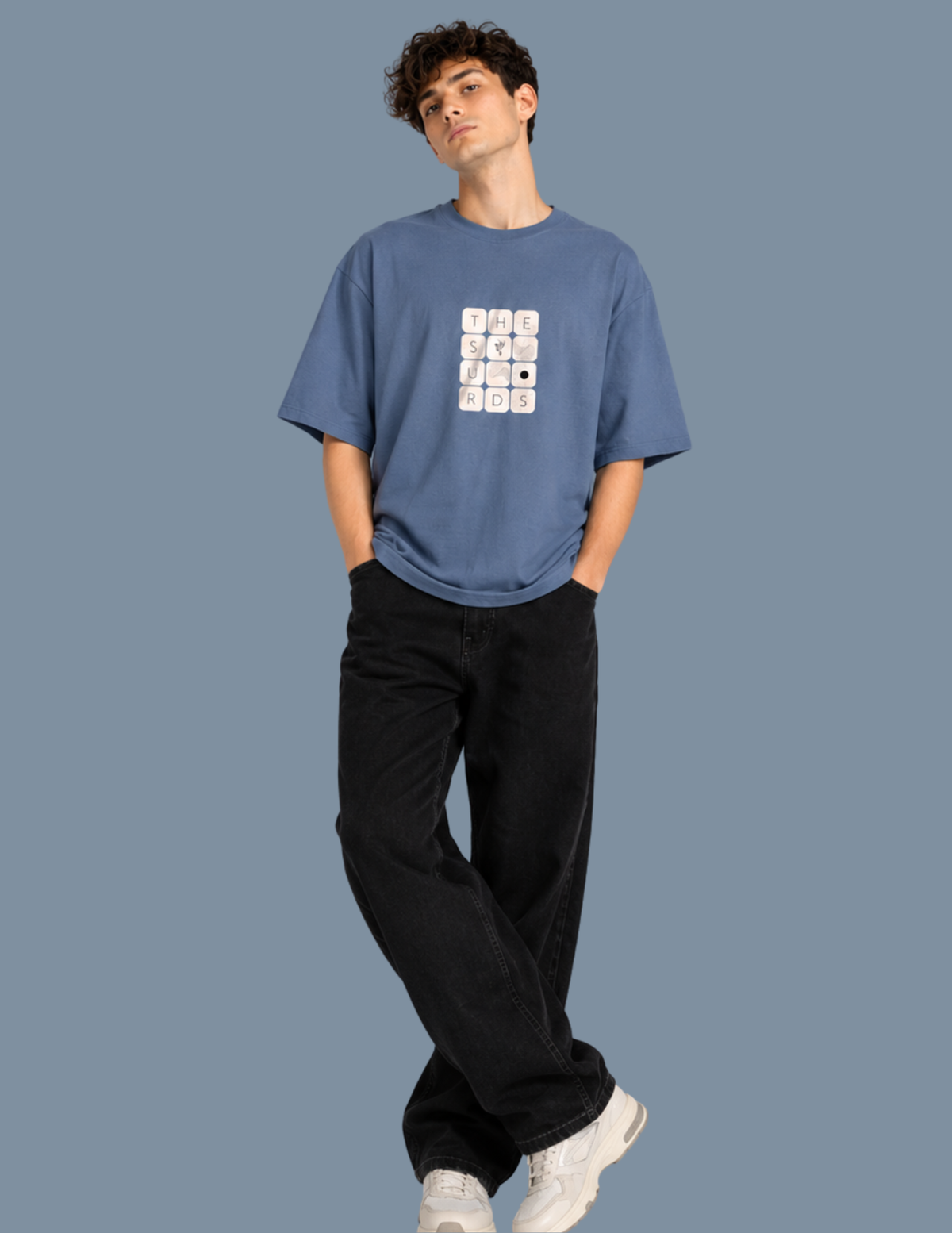 Play with words, wear your identity. The Surds Scrabble-inspired oversized T-shirt features a minimal tile-style graphic spelling out the brand name on a classic black base. Designed for a clean, effortless streetwear look.