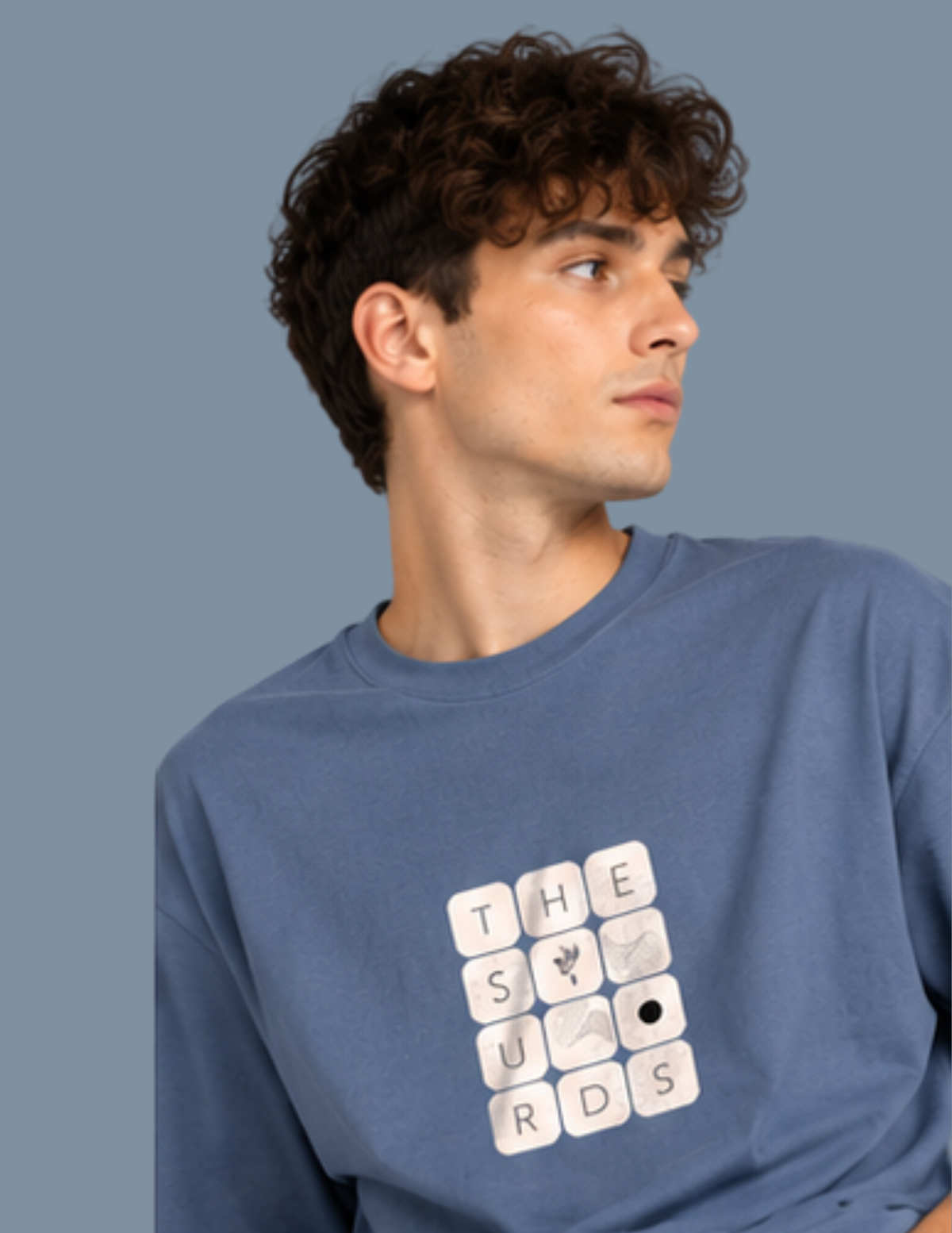Play with words, wear your identity. The Surds Scrabble-inspired oversized T-shirt features a minimal tile-style graphic spelling out the brand name on a classic black base. Designed for a clean, effortless streetwear look.