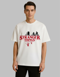 Person wearing a 'Stranger Things' t-shirt with a graphic design on a plain background