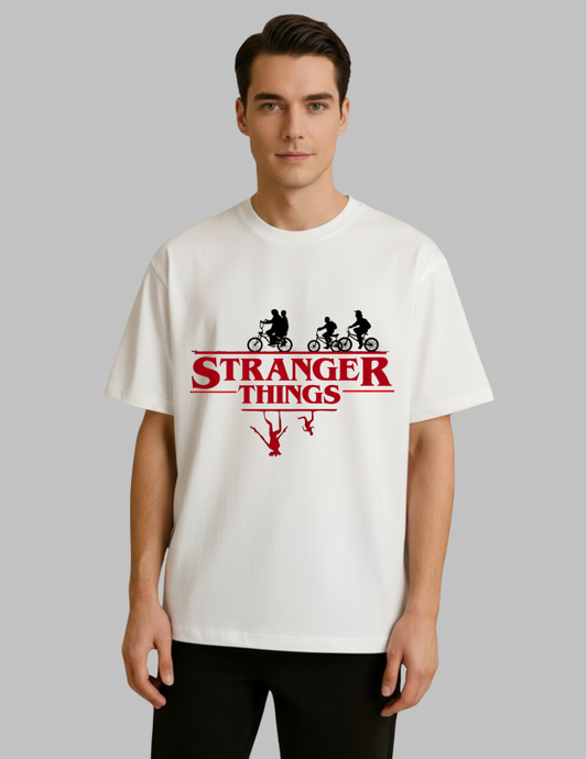 Person wearing a 'Stranger Things' t-shirt with a graphic design on a plain background