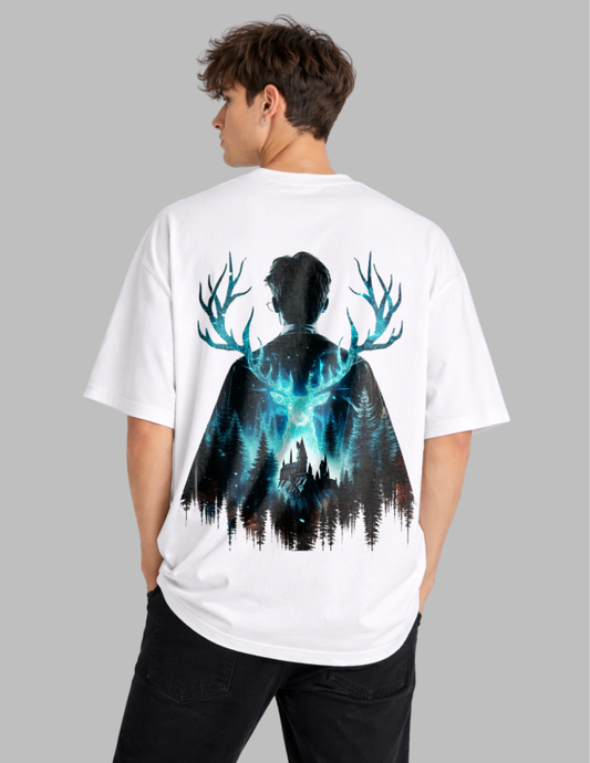 Person wearing a white t-shirt with a graphic design on the back, featuring a silhouette of a person with deer antlers and a forest.