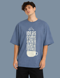 Person wearing a blue t-shirt with a coffee-themed graphic and text.