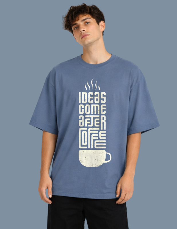 Person wearing a blue t-shirt with a coffee-themed graphic and text.
