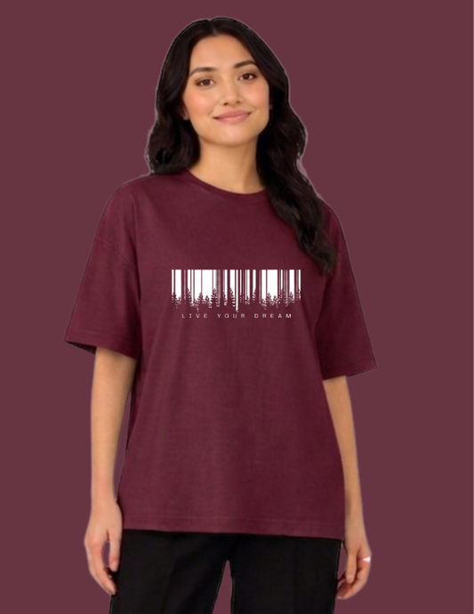 Person wearing a maroon t-shirt with a barcode design and text on a matching background