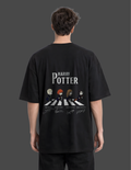 Person wearing a black 'Harry Potter' t-shirt with a graphic design on the back.