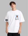Person wearing a white t-shirt with a graphic design on a gray background