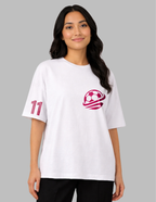 Woman wearing a white t-shirt with a red logo and number 11 on a gray background