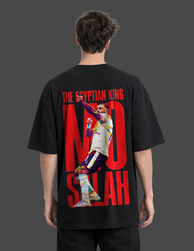 Person wearing a black t-shirt with a graphic and text on the back, on a plain background