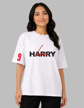 Person wearing a white t-shirt with red and black text on a gray background