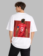 Person wearing a white t-shirt with a graphic of a football player in a red jersey on the back.
