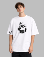 Person wearing a white t-shirt with black graphic design on a gray background