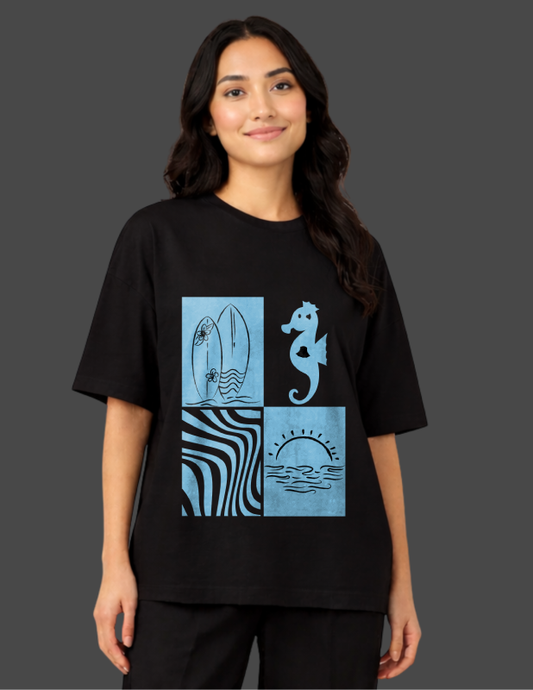 Person wearing a black t-shirt with blue graphic design on a dark background