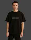 Person wearing a black t-shirt with 'Limited Edition' text on a plain background