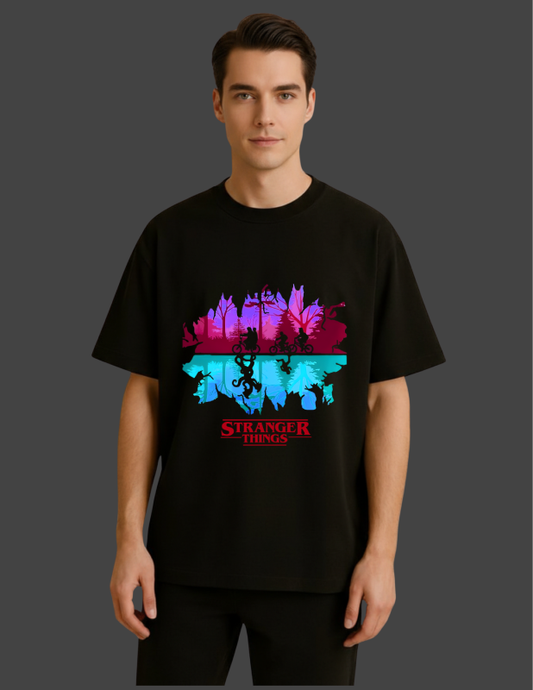 Person wearing a black t-shirt with 'Stranger Things' graphic design on a dark background