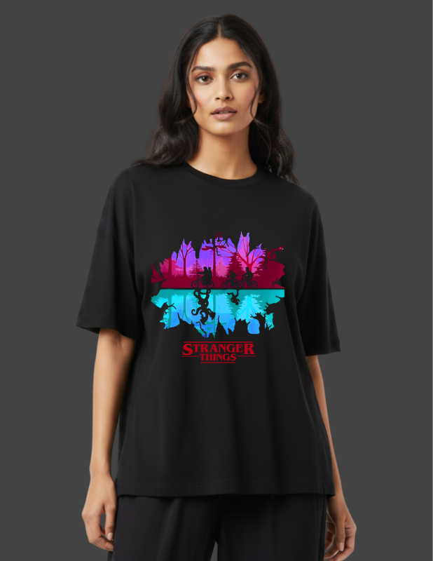 Person wearing a black t-shirt with a colorful 'Stranger Things' graphic design on a dark background