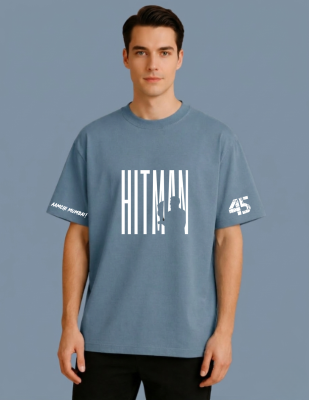 Man wearing a blue t-shirt with 'Hitman' and '45' text on a gray background