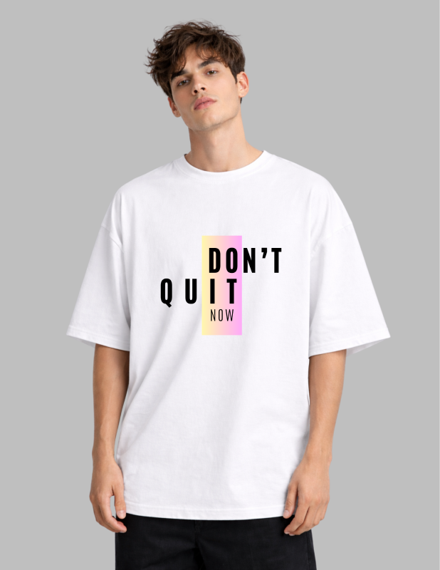 Person wearing a white t-shirt with 'DON'T QUIT NOW' text on a gray background