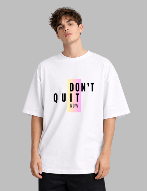 Person wearing a white t-shirt with 'DON'T QUIT NOW' text on a gray background